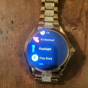 It’s a gold woman Michael Kors watch